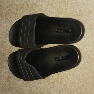 All black adidas slides